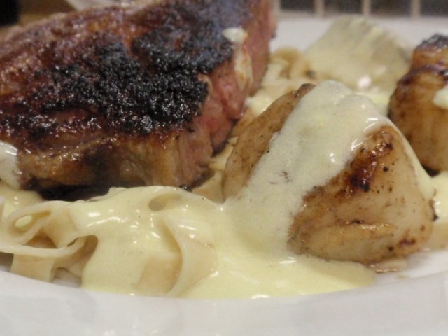 Surf n Turf!  Seared Scallops in Saffron Sauce with Porterhouse Steak :D