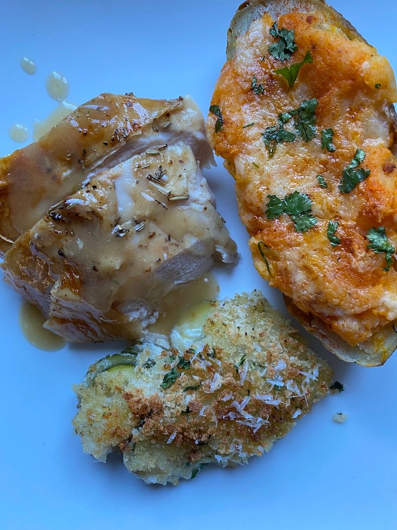 this is a photo of roasted chicken, potatoes and zucchini