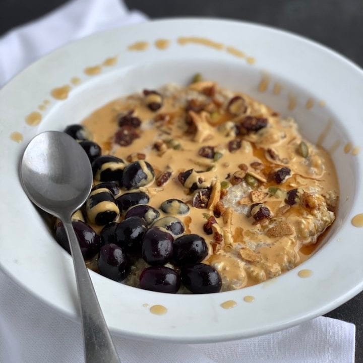 this is a photo of overnight quinoa oats with roasted grapes and peanut butter