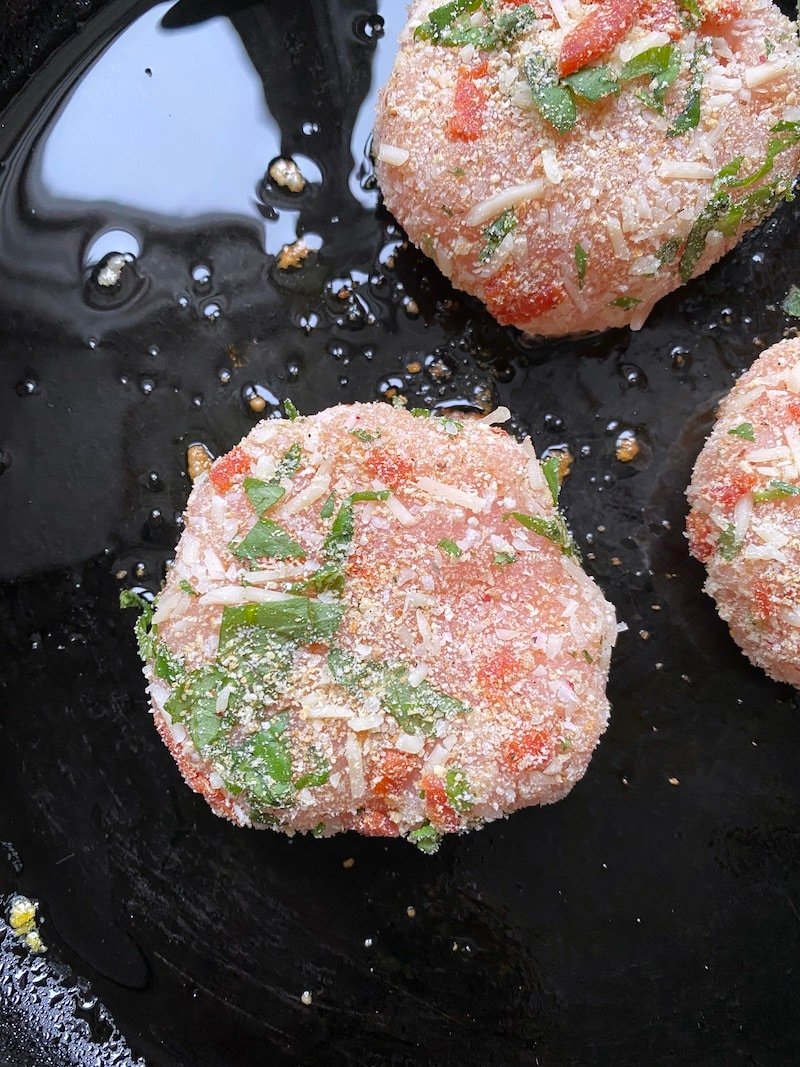 this is a photo of a turkey burger seasoned and ready to cook