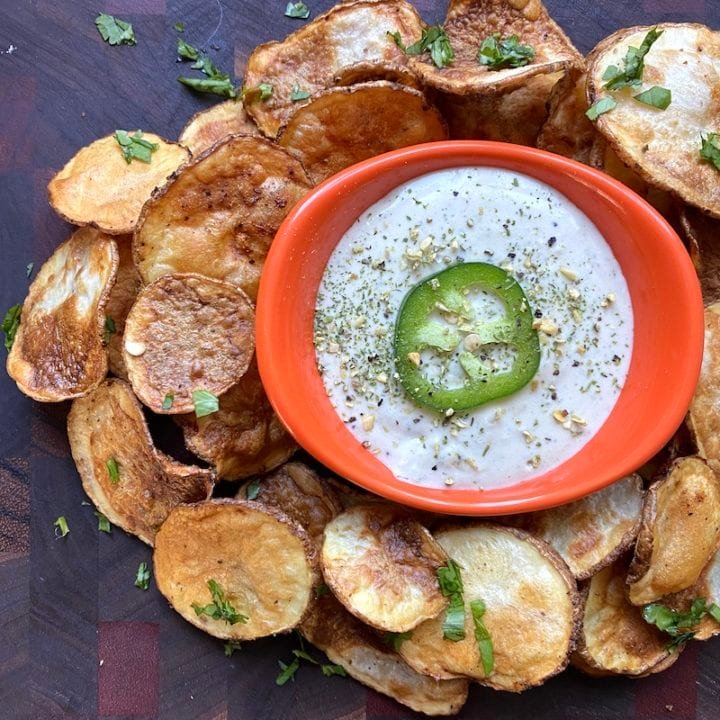 this is a photo of homemade potato chips with a spicy dipping sauce