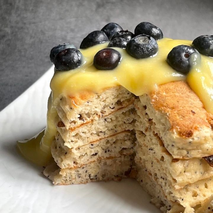 this is a photo of poppy seed pancakes with lemon curd