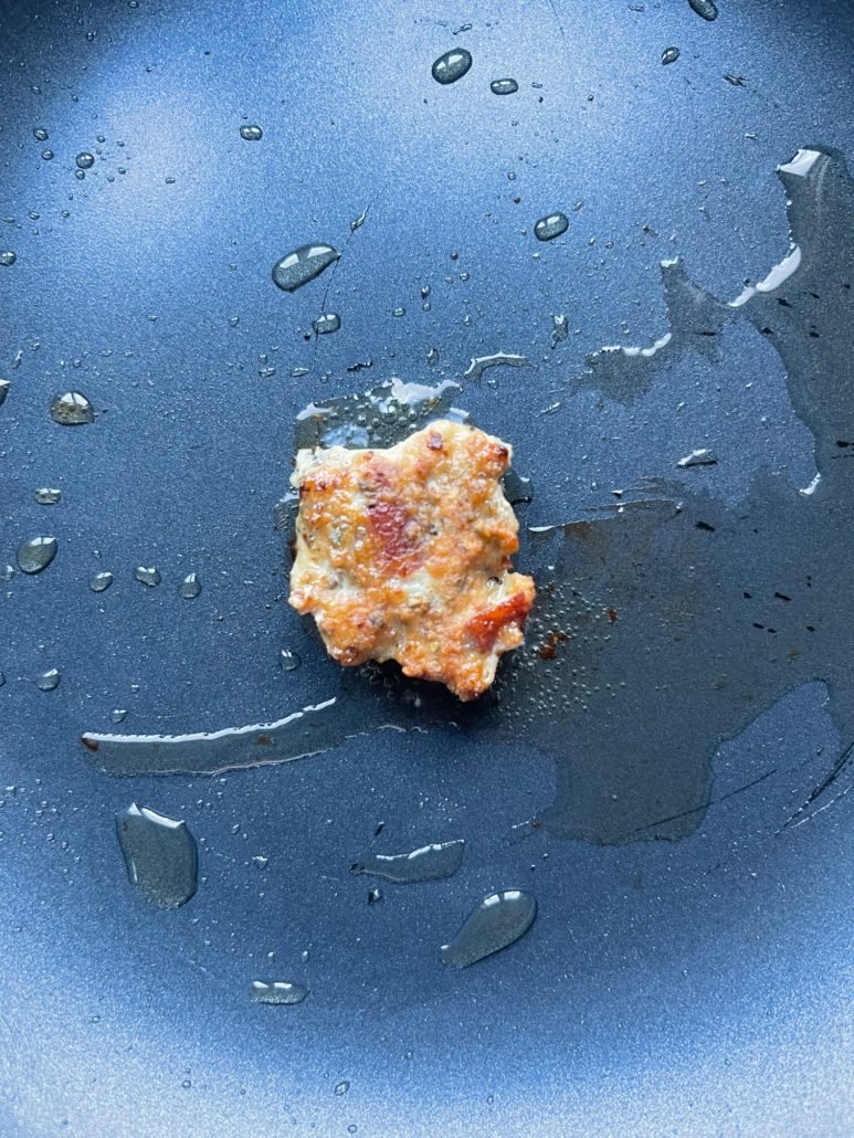 This is a photo of a turkey meatball being seared for taste