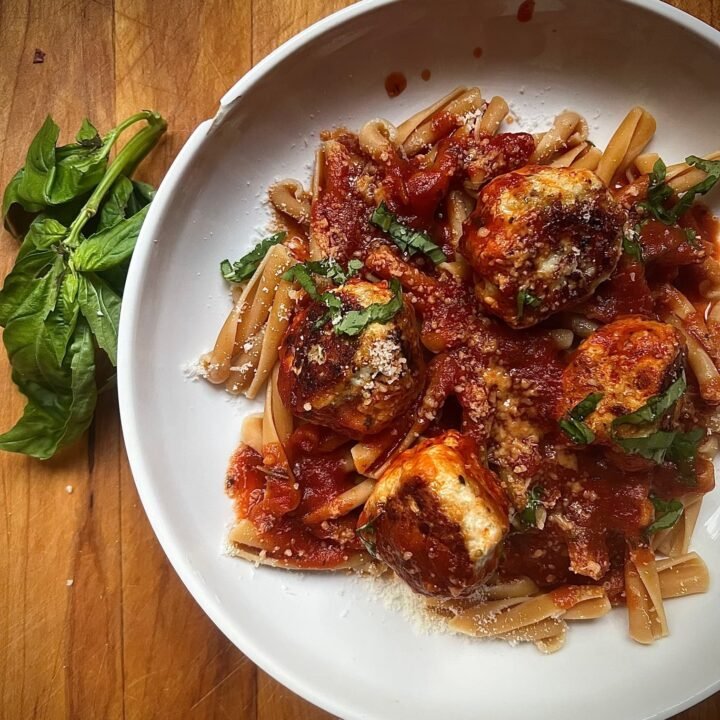 this is a bowl of pasta with turkey meatballs