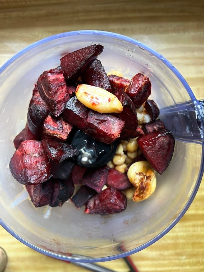 beet hummus ingredients in a food processor