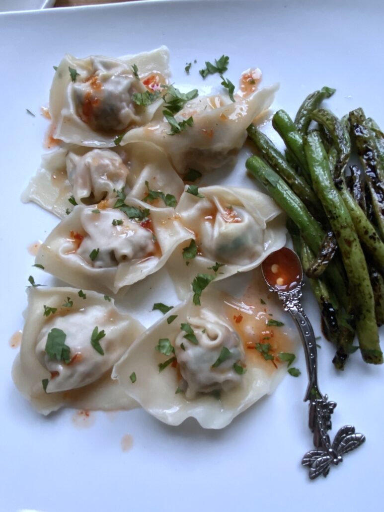 this is a plate of pork and mushroom wontons