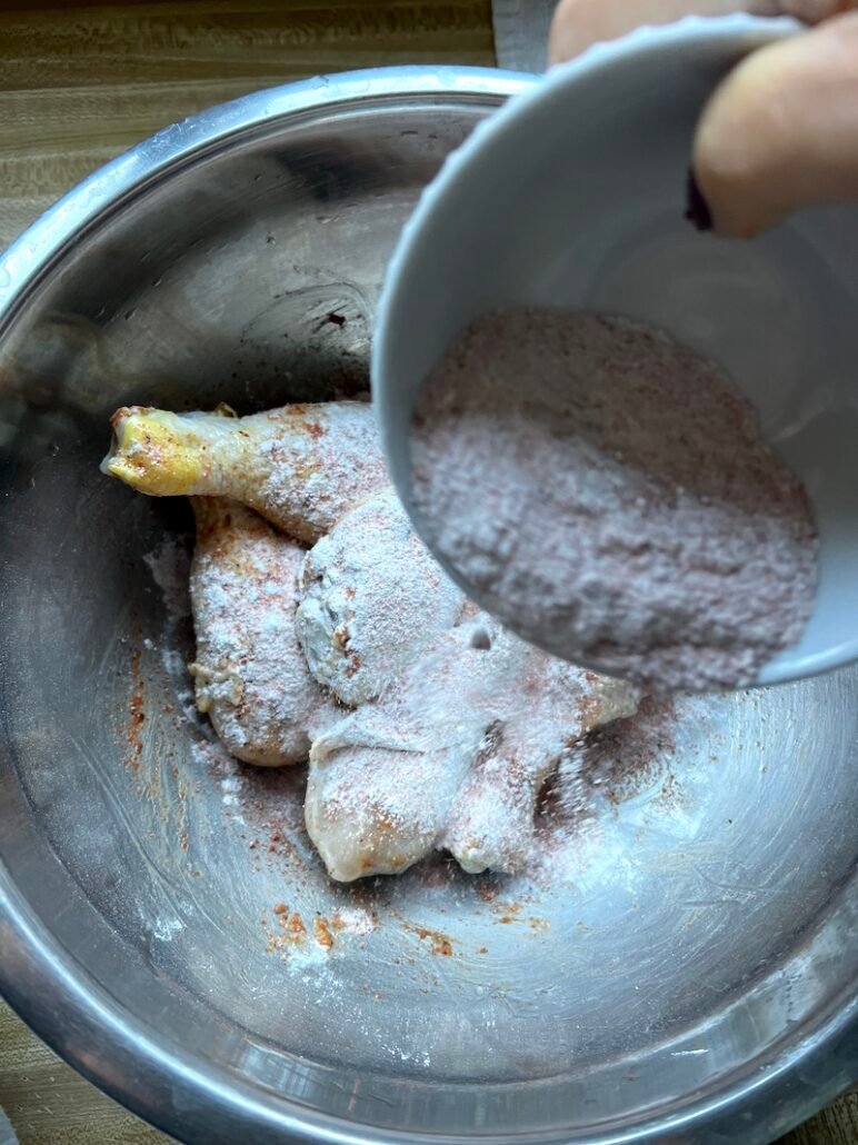 this is a photo of adding seasoning to brined chicken