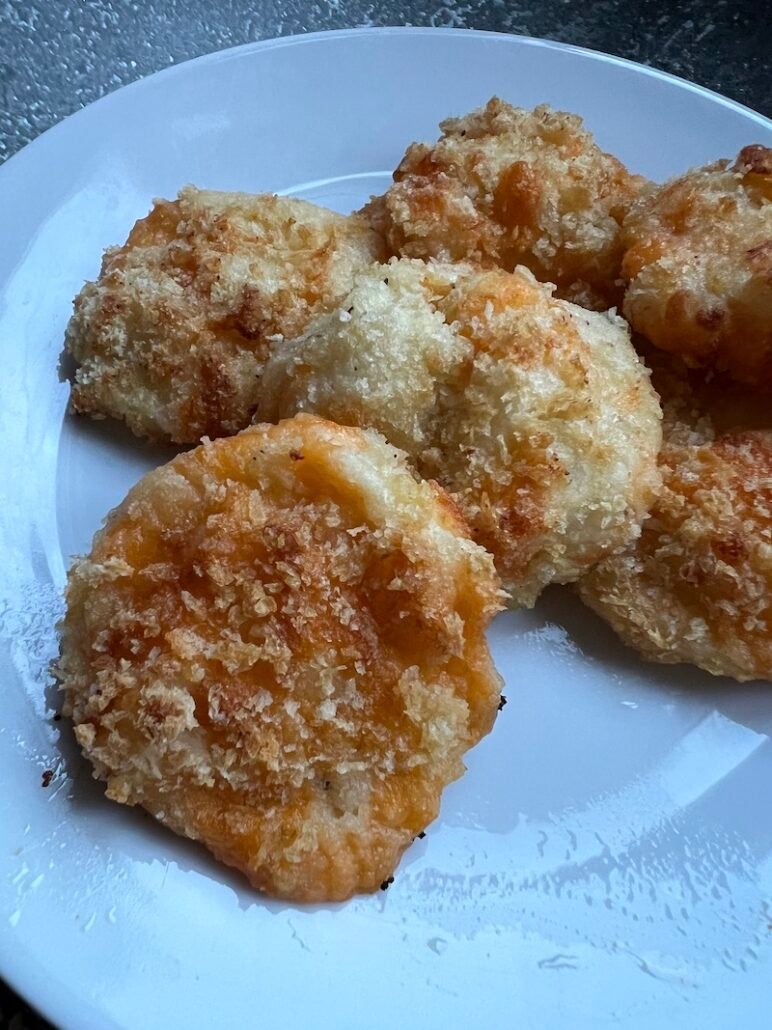 this is a plate of mashed potato croquettes