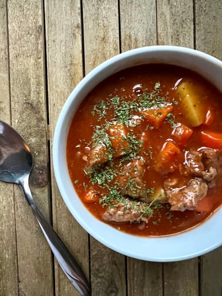 this is a bowl of golden mushroom beef stew