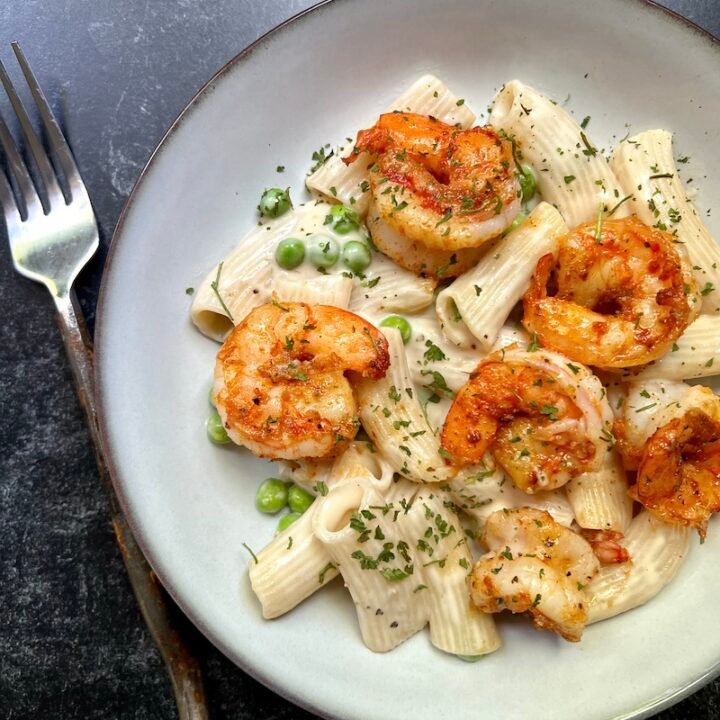 this is a bowl of creamy pasta with shrimp