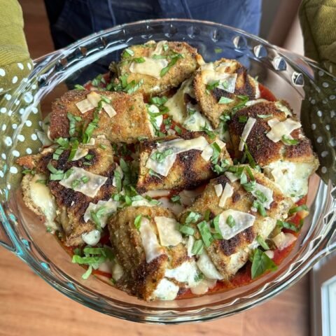 this is an eggplant rollatini in a baking dish