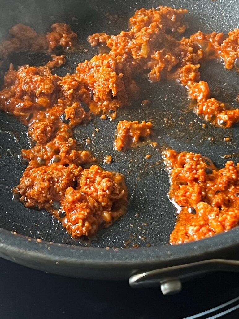 this is chicken chorizo cooking in a skillet