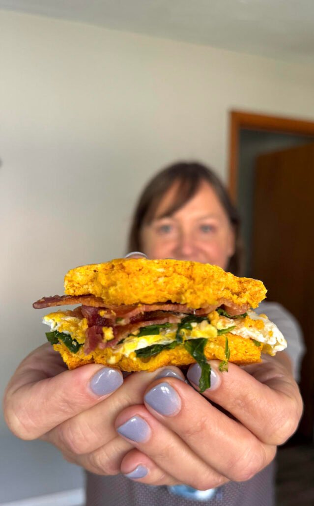 this is a breakfast sandwich on a pumpkin biscuit